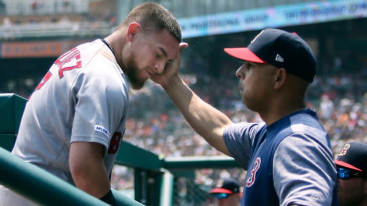 DETROIT, MI - JULY 7: Christian Vazquez #7 of the Boston Red Sox is congratulated by manager Alex Cora #20 of the Boston Red Sox after hitting a two-run home run against the Detroit Tigers during the second inning at Comerica Park on July 7, 2019 in Detroit, Michigan. (Photo by Duane Burleson/Getty Images)