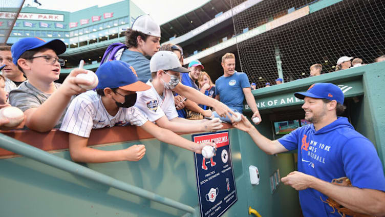 Sep 21, 2021; Boston, Massachusetts, USA; New York Mets starting pitcher Rich Hill (21) signs a baseball for a fan prior to a game against the Boston Red Sox at Fenway Park. Mandatory Credit: Bob DeChiara-USA TODAY Sports