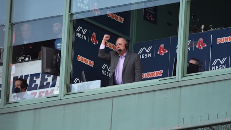 Jun 25, 2021; Boston, Massachusetts, USA; Boston Red Sox broadcaster Jerry Remy signals to former second baseman Dustin Pedoria during pregame ceremonies in Pedoria's honor prior to a game against the New York Yankees at Fenway Park. Mandatory Credit: Bob DeChiara-USA TODAY Sports