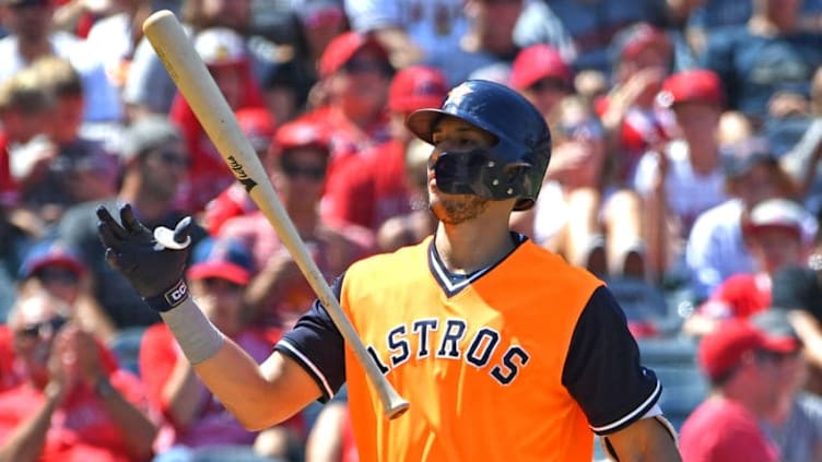 ANAHEIM, CA - AUGUST 26: Carlos Correa #1 of the Houston Astros tosses his bat after striking out in the fourth inning against the Los Angeles Angels of Anaheim at Angel Stadium on August 26, 2018 in Anaheim, California. All players across MLB will wear nicknames on their backs as well as colorful, non-traditional uniforms featuring alternate designs inspired by youth-league uniforms during Players Weekend. (Photo by Jayne Kamin-Oncea/Getty Images)