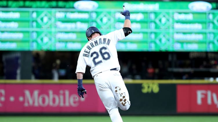 SEATTLE, WA - SEPTEMBER 25: Chris Herrmann #26 of the Seattle Mariners laps the bases after hitting a two run home run against the Oakland Athletics in the eleventh inning to win the game 10-8 during their game at Safeco Field on September 25, 2018 in Seattle, Washington. (Photo by Abbie Parr/Getty Images)