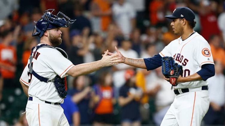 HOUSTON, TX - JUNE 26: Brian McCann #16 of the Houston Astros shakes handswith Hector Rondon #30 after the final out against the Toronto Blue Jays at Minute Maid Park on June 26, 2018 in Houston, Texas. (Photo by Bob Levey/Getty Images)