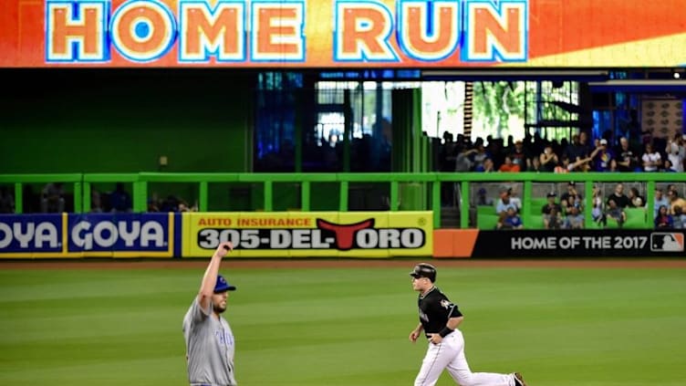 Jun 25, 2016; Miami, FL, USA; Miami Marlins first baseman Justin Bour (41) rounds the bases after hitting a two run home run off of Chicago Cubs starting pitcher John Lackey (41) during the fourth inning at Marlins Park. Mandatory Credit: Steve Mitchell-USA TODAY Sports