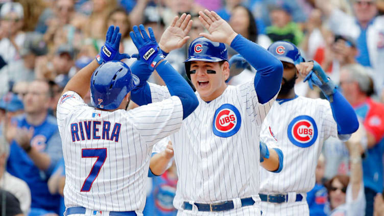 CHICAGO, IL - SEPTEMBER 02: Rene Rivera #7 of the Chicago Cubs is congratulated by Anthony Rizzo #44 after hitting a grand slam against the Atlanta Braves during the second inning at Wrigley Field on September 2, 2017 in Chicago, Illinois. (Photo by Jon Durr/Getty Images)