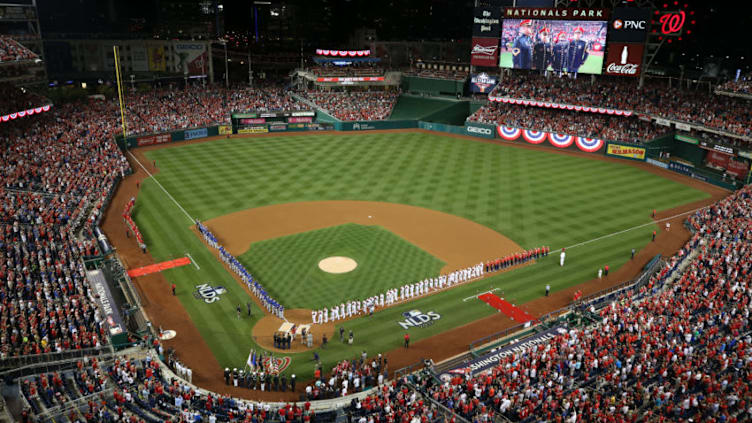 WASHINGTON, DC - OCTOBER 06: The Chicago Cubs and Washington Nationals stand during the national anthem prior to game one of the National League Division Series at Nationals Park on October 6, 2017 in Washington, DC. (Photo by Dan Kubus/Getty Images)