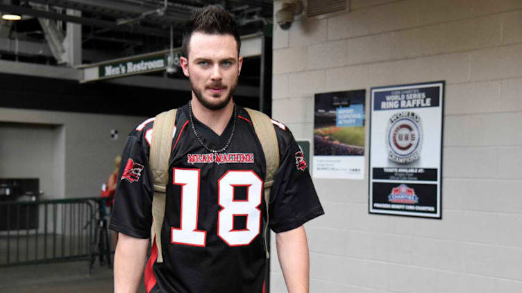 CHICAGO, IL - SEPTEMBER 03: Kris Bryant of the Chicago Cubs wears a football jersey as the Cubs leave on their road trip. on September 3, 2017 at Wrigley Field in Chicago, Illinois. (Photo by David Banks/Getty Images)