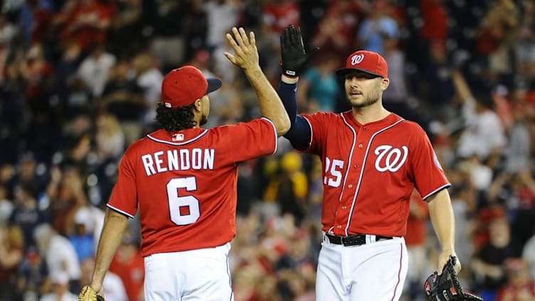 Jul 16, 2016; Washington, DC, USA; Washington Nationals third baseman Anthony Rendon (6) celebrates with first baseman Clint Robinson (25) after the final out against the Pittsburgh Pirates at Nationals Park. Mandatory Credit: Brad Mills-USA TODAY Sports