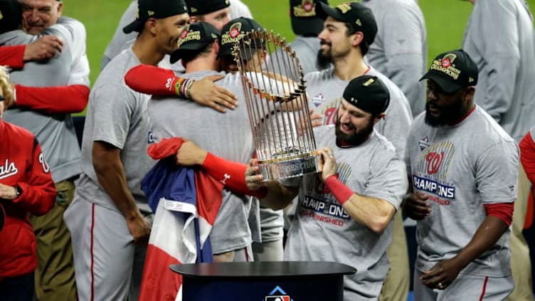 HOUSTON, TEXAS - OCTOBER 30: Adam Eaton #2 of the Washington Nationals holds the Commissioners Trophy after defeating the Houston Astros 6-2 in Game Seven to win the 2019 World Series in Game Seven of the 2019 World Series at Minute Maid Park on October 30, 2019 in Houston, Texas. (Photo by Bob Levey/Getty Images)