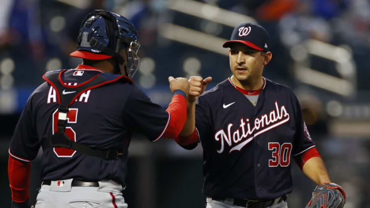 Paolo Espino #30 of the Washington Nationals celebrates with Alex Avila #6 of the Washington Nationals after defeating the New York Mets 7-1 at Citi Field on April 24, 2021 in the Flushing neighborhood of the Queens borough of New York City. (Photo by Adam Hunger/Getty Images)