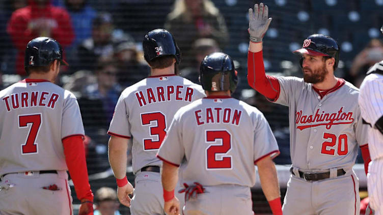 DENVER, CO - APRIL 27: Trea Turner #7, Bryce Harper and Adam Eaton #2 of the Washington Nationals are congratulated by Daniel Murphy #20 after scoring on a Bryce Harper 3 RBI home run in the seventh inning against the Colorado Rockies at Coors Field on April 27, 2017 in Denver, Colorado. (Photo by Matthew Stockman/Getty Images)