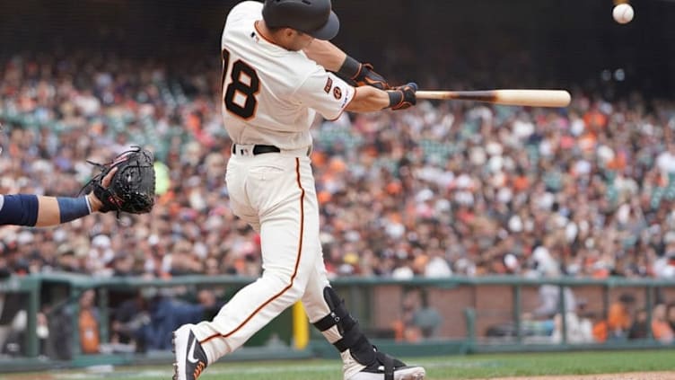 SAN FRANCISCO, CA - APRIL 06: Connor Joe #18 of the San Francisco Giants hits a base hit against the Tampa Bay Rays in the bottom of the fifth inning of a Major League Baseball game at Oracle Park on April 6, 2019 in San Francisco, California. The hit was the first of Connor Joe's Major League career. (Photo by Thearon W. Henderson/Getty Images)