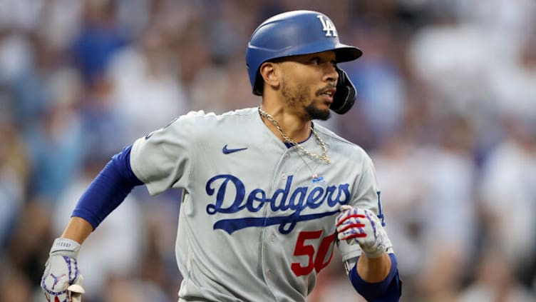 DENVER, COLORADO - JULY 17: Mookie Betts #50 of the Los Angeles Dodgers runs after hitting a double against the Colorado Rockies in the seventh inning at Coors Field on July 17, 2021 in Denver, Colorado. (Photo by Matthew Stockman/Getty Images)