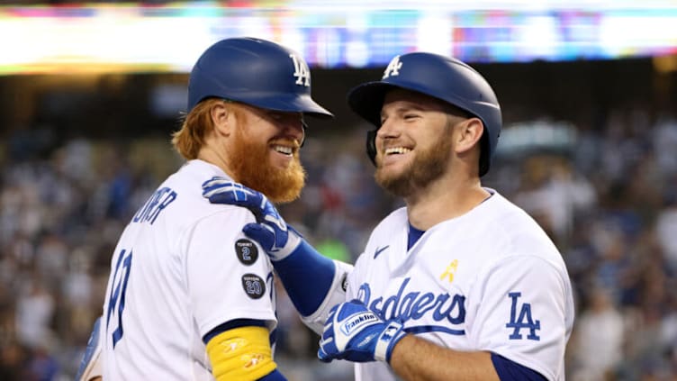 LOS ANGELES, CALIFORNIA - SEPTEMBER 01: Max Muncy #13 of the Los Angeles Dodgers celebrates his solo homerun with Justin Turner #10, to take a 1-0 lead over the Atlanta Braves, during the first inning at Dodger Stadium on September 01, 2021 in Los Angeles, California. (Photo by Harry How/Getty Images)