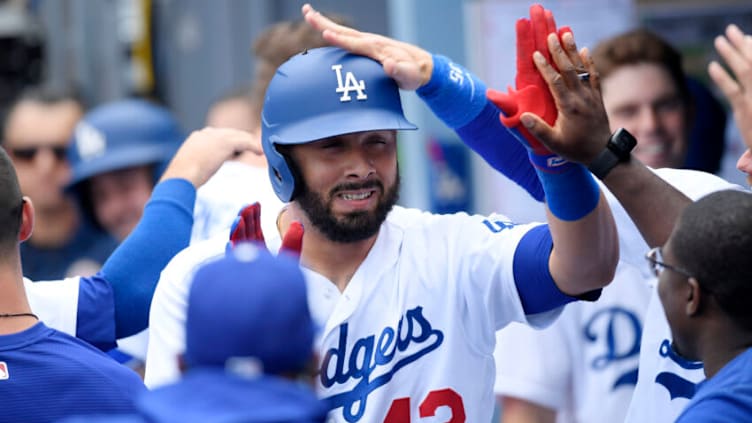 LOS ANGELES, CA - APRIL 20: Edwin Rios #43 of the Los Angeles Dodgers gets a pat on the helmet from Cody Bellinger as they celebrate the one run home run against starting pitcher Charlie Morton #50 of the Atlanta Braves during the fifth inning at Dodger Stadium on April 20, 2022 in Los Angeles, California. (Photo by Kevork Djansezian/Getty Images)