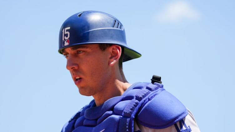 CINCINNATI, OHIO - JUNE 23: Austin Barnes #15 of the Los Angeles Dodgers walks across the field in the seventh inning against the Cincinnati Reds at Great American Ball Park on June 23, 2022 in Cincinnati, Ohio. (Photo by Dylan Buell/Getty Images)