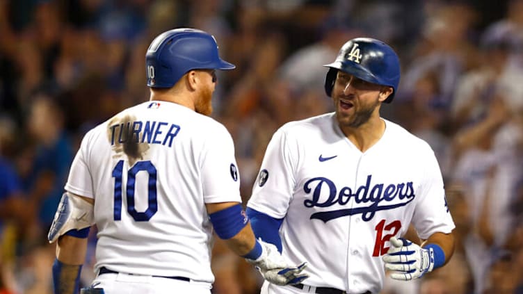 LOS ANGELES, CALIFORNIA - AUGUST 10: Joey Gallo #12 of the Los Angeles Dodgers celebrates with Justin Turner #10 after hitting a three-run home run against the Minnesota Twins in the seventh inning at Dodger Stadium on August 10, 2022 in Los Angeles, California. (Photo by Ronald Martinez/Getty Images)