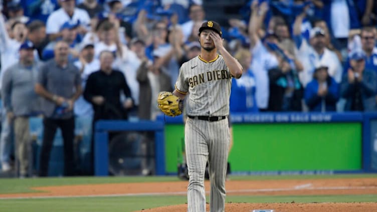 LOS ANGELES, CALIFORNIA - OCTOBER 12: Yu Darvish #11 of the San Diego Padres reacts after giving up a solo home run to Freddie Freeman #5 of the Los Angeles Dodgers in the first inning in game two of the National League Division Series at Dodger Stadium on October 12, 2022 in Los Angeles, California. (Photo by Kevork Djansezian/Getty Images)