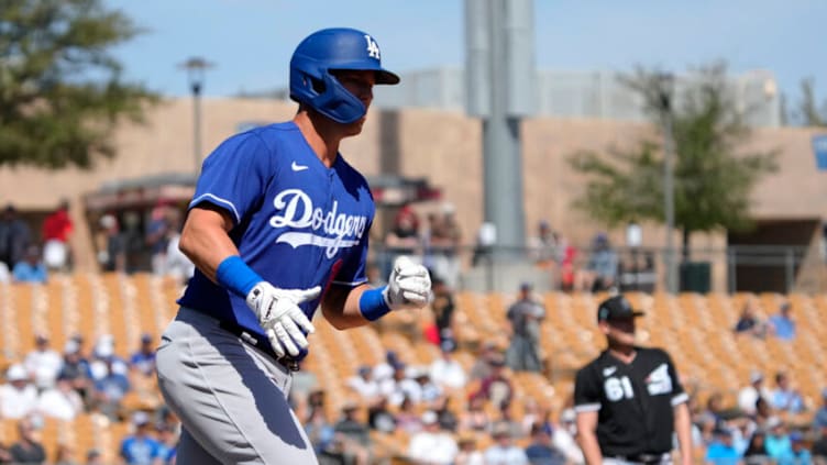 Mar 21, 2022; Phoenix, Arizona, USA; Los Angeles Dodgers first baseman Jake Lamb (18) runs the bases after hitting a solo home run against the Chicago White Sox in the third inning during a spring training game at Camelback Ranch-Glendale. Mandatory Credit: Rick Scuteri-USA TODAY Sports