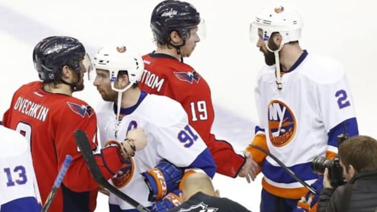 Apr 27, 2015; Washington, DC, USA; Washington Capitals left wing Alex Ovechkin (8) shakes hands with New York Islanders center John Tavares (91) as Capitals center Nicklas Backstrom (19) shakes hands with Islanders defenseman Nick Leddy (2) after their game in game seven of the first round of the 2015 Stanley Cup Playoffs at Verizon Center. The Capitals won 2-1, and won the series 4-3. Mandatory Credit: Geoff Burke-USA TODAY Sports