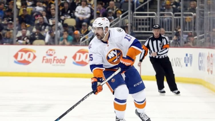 Mar 15, 2016; Pittsburgh, PA, USA; New York Islanders right wing Cal Clutterbuck (15) skates with the puck against the Pittsburgh Penguins during the third period at the CONSOL Energy Center. The Penguins won 2-1 in a shootout. Mandatory Credit: Charles LeClaire-USA TODAY Sports