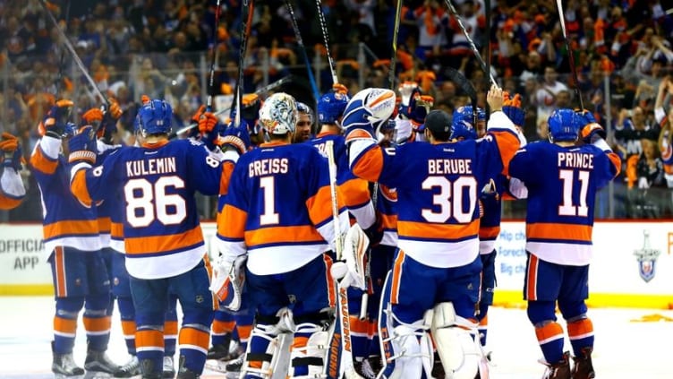Apr 24, 2016; Brooklyn, NY, USA; The New York Islanders salute their fans after defeating the Florida Panthers in game six of the first round of the 2016 Stanley Cup Playoffs at Barclays Center. The Islanders defeated the Panthers 2-1 to win the series four games to two. Mandatory Credit: Andy Marlin-USA TODAY Sports