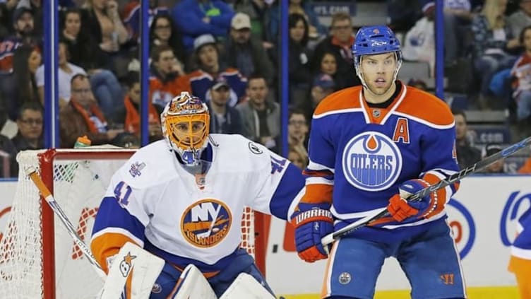 Feb 28, 2016; Edmonton, Alberta, CAN; Edmonton Oilers forward Taylor Hall (4) tries to screen New York Islanders goaltender Jaroslav Halak (41) during the first period at Rexall Place. Mandatory Credit: Perry Nelson-USA TODAY Sports