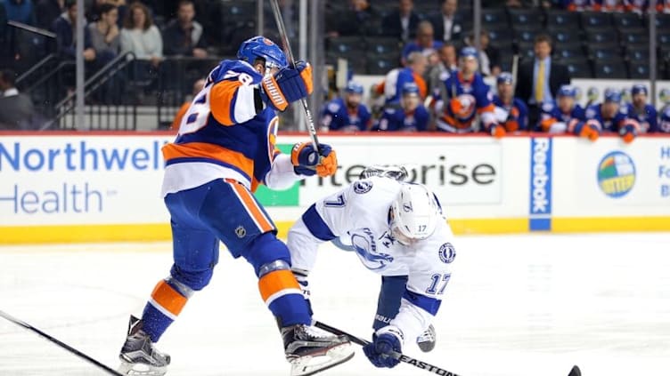 Apr 4, 2016; Brooklyn, NY, USA; New York Islanders defenseman Marek Zidlicky (28) and Tampa Bay Lightning center Alex Killorn (17) fight for the puck during the first period at Barclays Center. Mandatory Credit: Brad Penner-USA TODAY Sports