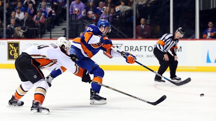 Dec 21, 2015; Brooklyn, NY, USA; New York Islanders center Brock Nelson (29) shoots as Anaheim Ducks defenseman Cam Fowler (4) reaches during the second period at Barclays Center. Mandatory Credit: Anthony Gruppuso-USA TODAY Sports