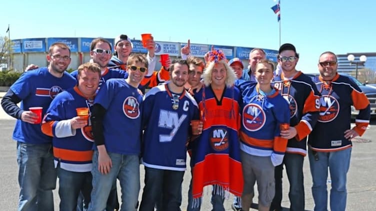 Apr 25, 2015; Uniondale, NY, USA; New York Islanders fans pose for a photo prior to the final Islanders game to be played in Nassau Coliseum game in six of the first round of the 2015 Stanley Cup Playoffs between the Washington Capitals and New York Islanders at Nassau Veterans Memorial Coliseum. Mandatory Credit: Andy Marlin-USA TODAY Sports