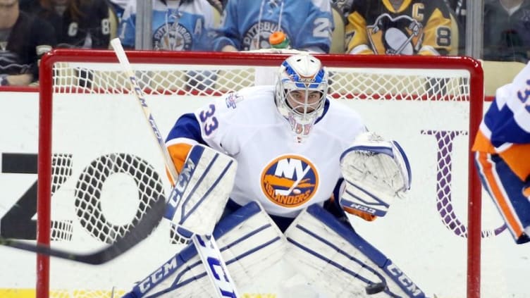 Jan 2, 2016; Pittsburgh, PA, USA; New York Islanders goalie Christopher Gibson (33) prepares to make a save against the Pittsburgh Penguins during the third period at the CONSOL Energy Center. The Penguins won 5-2. Mandatory Credit: Charles LeClaire-USA TODAY Sports