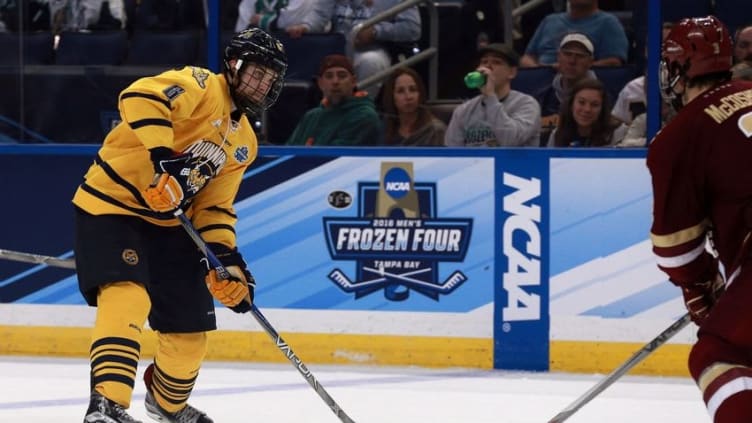 Apr 7, 2016; Tampa, FL, USA; Quinnipiac Bobcats defenseman Devon Toews (6) shoots against the Boston College Eagles during the second period of the semifinals of the 2016 Frozen Four college ice hockey tournament at Amalie Arena. Mandatory Credit: Kim Klement-USA TODAY Sports