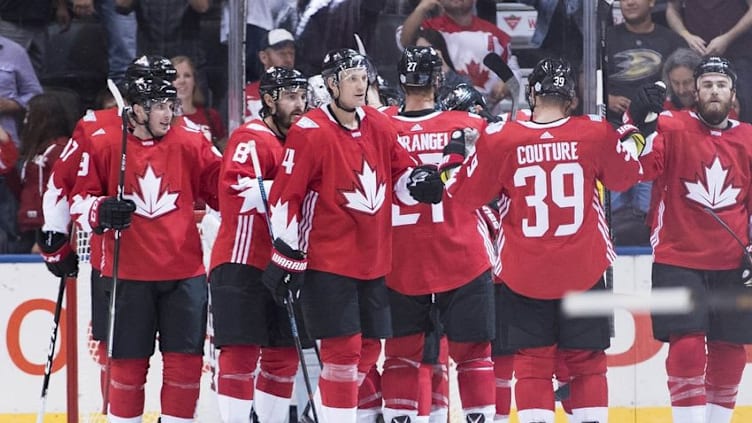 Sep 17, 2016; Toronto, Ontario, Canada; Team Canada players Jay Bouwmeester (4) and Logan Couture (39) celebrate the win at the end of the preliminary round play against Team Czech Republic in the 2016 World Cup of Hockey at Air Canada Centre. Team Canada won 6-0. Mandatory Credit: Nick Turchiaro-USA TODAY Sports