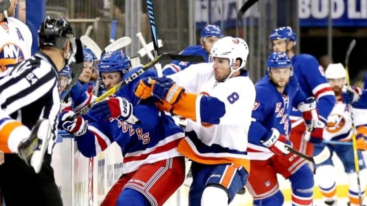 Sep 27, 2016; New York, NY, USA; New York Rangers laft wing Marek Hrivik (46) and New York Islanders right wing Steve Bernier (8) battle for a loose puck during the first period during a preseason hockey game at Madison Square Garden. Mandatory Credit: Andy Marlin-USA TODAY Sports