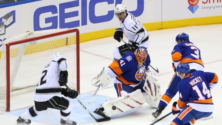 Mar 26, 2015; Uniondale, NY, USA; New York Islanders goalie Jaroslav Halak (41) makes a save against Los Angeles Kings center Anze Kopitar (11) during the first period at Nassau Veterans Memorial Coliseum. Mandatory Credit: Anthony Gruppuso-USA TODAY Sports