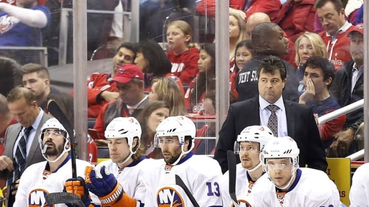 Apr 27, 2015; Washington, DC, USA; New York Islanders head coach Jack Capuano (R) looks on from behind the bench against the Washington Capitals in the first period in game seven of the first round of the 2015 Stanley Cup Playoffs at Verizon Center. The Capitals won 2-1, and won the series 4-3. Mandatory Credit: Geoff Burke-USA TODAY Sports