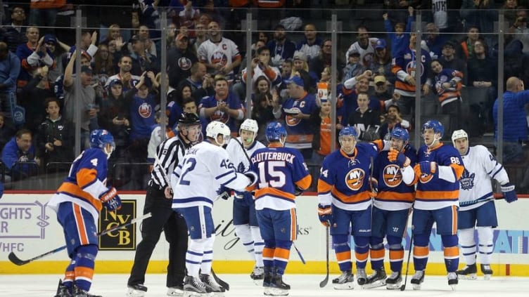 Oct 30, 2016; Brooklyn, NY, USA; New York Islanders center Casey Cizikas (53) celebrates his goal against the Toronto Maple Leafs with New York Islanders defenseman Calvin de Haan (44) and New York Islanders left wing Nikolay Kulemin (86) during the first period at Barclays Center. Mandatory Credit: Brad Penner-USA TODAY Sports