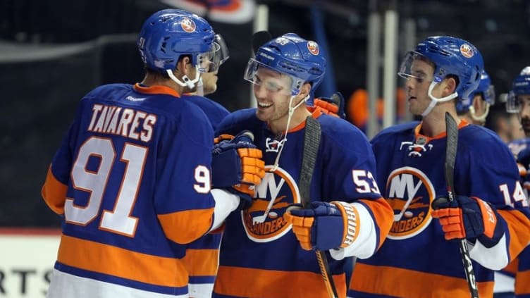 Oct 30, 2016; Brooklyn, NY, USA; New York Islanders center Casey Cizikas (53) and New York Islanders center John Tavares (91) celebrate after defeating the Toronto Maple Leafs at Barclays Center. Mandatory Credit: Brad Penner-USA TODAY Sports