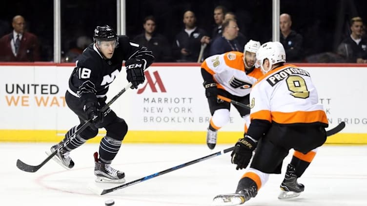 Nov 3, 2016; Brooklyn, NY, USA; New York Islanders right wing Ryan Strome (18) sends the puck past Philadelphia Flyers defenseman Ivan Provorov (9) during the second period at Barclays Center. Mandatory Credit: Anthony Gruppuso-USA TODAY Sports