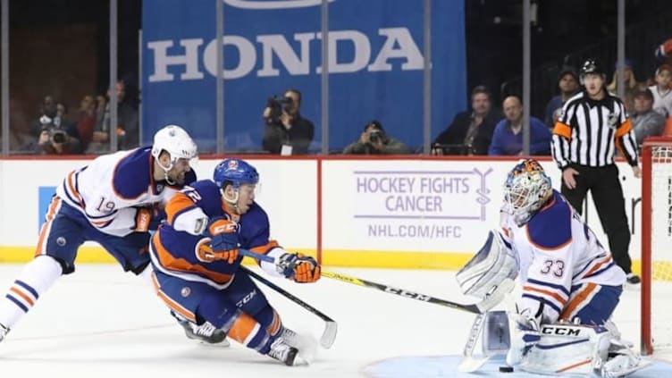 Nov 5, 2016; Brooklyn, NY, USA; Edmonton Oilers left wing Patrick Maroon (19) and Oilers goalkeeper Cam Talbot (33) defend a shot by New York Islanders left wing Anthony Beauvillier (72) during the second period at Barclays Center. Mandatory Credit: Anthony Gruppuso-USA TODAY Sports