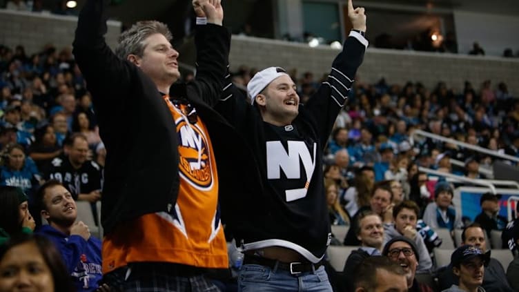 Nov 25, 2016; San Jose, CA, USA; Fans of the New York Islanders cheer as they score the tying goal in the third period of the game against San Jose Sharks at SAP Center at San Jose. The San Jose Sharks defeated the New York Islanders with a score of 3-2. Mandatory Credit: Stan Szeto-USA TODAY Sports