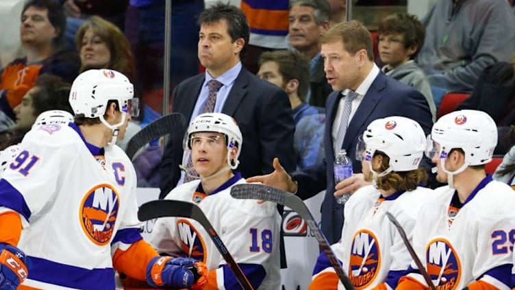 Feb 17, 2015; Raleigh, NC, USA; New York Islanders assistant coach Doug Weight talks to forward John Tavares (91) during a time out against the Carolina Hurricanes at PNC Arena. The New York Islanders defeated the Carolina Hurricanes 4-1. Mandatory Credit: James Guillory-USA TODAY Sports