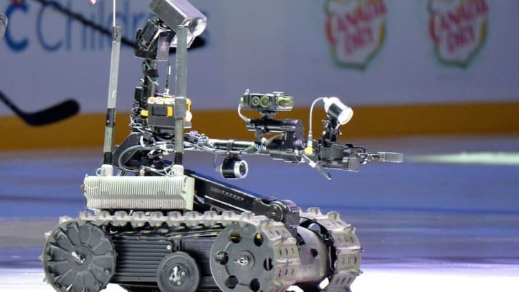 Nov 11, 2015; Anaheim, CA, USA; A hazmat robot brings the puck on the ice to commemorate Veterans Day during Military Appreciation night before NHL match between the Edmonton Oilers and the Anaheim Ducks at Honda Center. Mandatory Credit: Kirby Lee-USA TODAY Sports