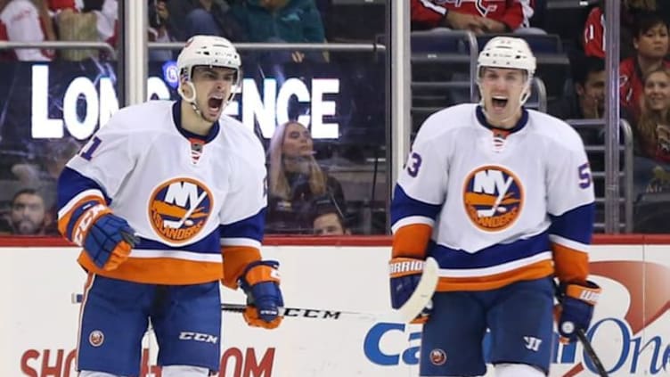 Dec 1, 2016; Washington, DC, USA; New York Islanders center Shane Prince (11) celebrates with Islanders center Casey Cizikas (53) after scoring a goal against the Washington Capitals in the third period at Verizon Center. The Islanders won 3-0. Mandatory Credit: Geoff Burke-USA TODAY Sports