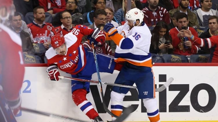 Dec 1, 2016; Washington, DC, USA; New York Islanders left wing Andrew Ladd (16) checks Washington Capitals center Marcus Johansson (90) in the second period at Verizon Center. The Islanders won 3-0. Mandatory Credit: Geoff Burke-USA TODAY Sports