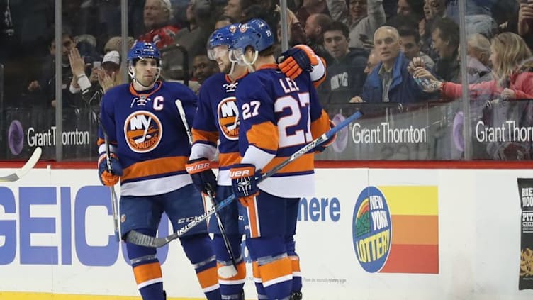 Dec 27, 2016; Brooklyn, NY, USA; New York Islanders left wing Anders Lee (27) celebrates his goal during the third period against the Washington Capitals at Barclays Center. The Islanders won 4-3. Mandatory Credit: Anthony Gruppuso-USA TODAY Sports