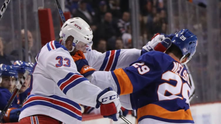 NEW YORK, NEW YORK - NOVEMBER 15: Brock Nelson #29 of the New York Islanders and Fredrik Claesson #33 of the New York Rangers battle during the second period at the Barclays Center on November 15, 2018 in the Brooklyn borough of New York City. (Photo by Bruce Bennett/Getty Images)