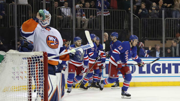 NEW YORK, NEW YORK - NOVEMBER 21: Kevin Hayes #13 of the New York Rangers (l) scores at 17:17 of the second period against Robin Lehner #40 of the the New York Islanders at Madison Square Garden on November 21, 2018 in New York City. (Photo by Bruce Bennett/Getty Images)