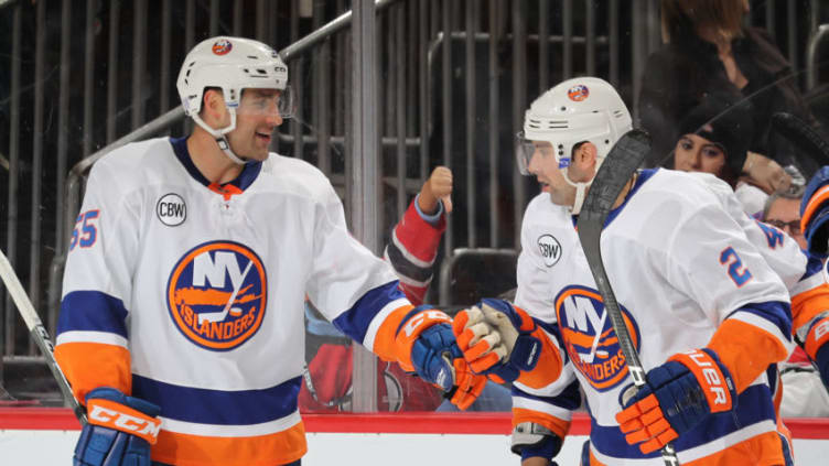 NEWARK, NEW JERSEY - NOVEMBER 23: Johnny Boychuk #55 of the New York Islanders congratulates Nick Leddy #2 of the New York Islanders after he scored in the third period against the New Jersey Devils at Prudential Center on November 23, 2018 in Newark, New Jersey. (Photo by Elsa/Getty Images)