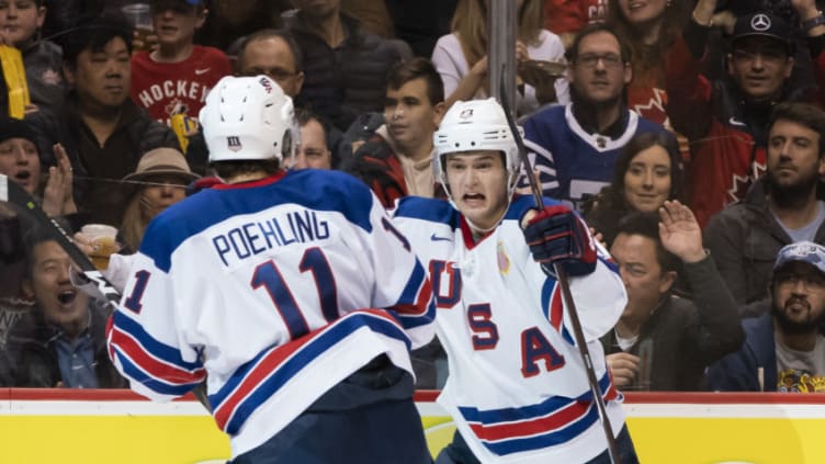 VANCOUVER, BC - JANUARY 4: Oliver Wahlstrom #18 of the United States celebrates with Ryan Poehling #11 after scoring a goal against Russia in Semifinals hockey action of the 2019 IIHF World Junior Championship on January, 4, 2019 at Rogers Arena in Vancouver, British Columbia, Canada. (Photo by Rich Lam/Getty Images)