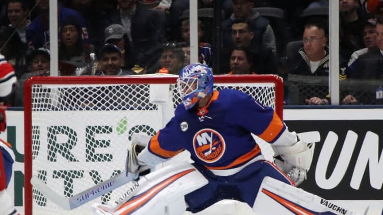 UNIONDALE, NEW YORK - JANUARY 08: Thomas Greiss #1 of the New York Islanders makes the second period save against the Carolina Hurricanes at NYCB Live at the Nassau Veterans Memorial Coliseum on January 08, 2019 in Uniondale, New York. (Photo by Bruce Bennett/Getty Images)